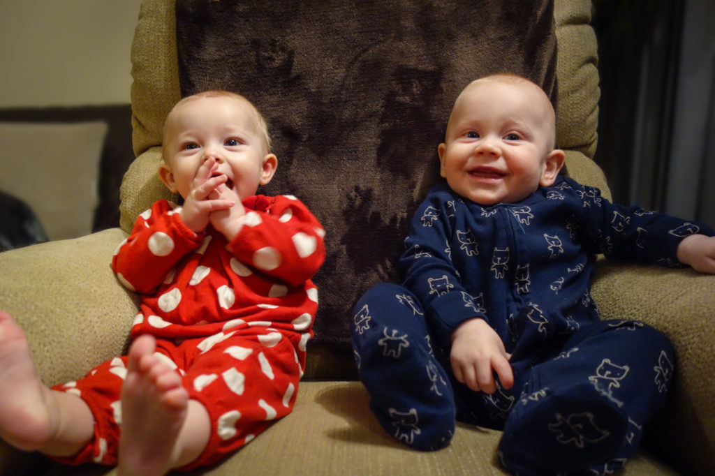 Addison and Colin sitting in chair.