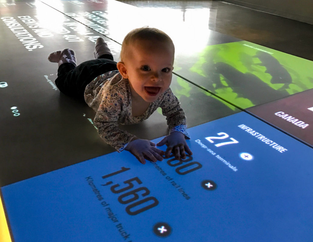 While Katie and Emily were on the Fly Over Canada ride, Chris watched the kids as they liked to crawl around on the light display.