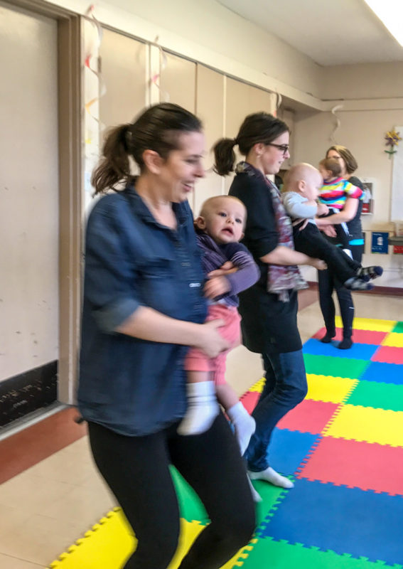 Katie and Emily dancing around at the Jump Start Jolly Jumper music program.