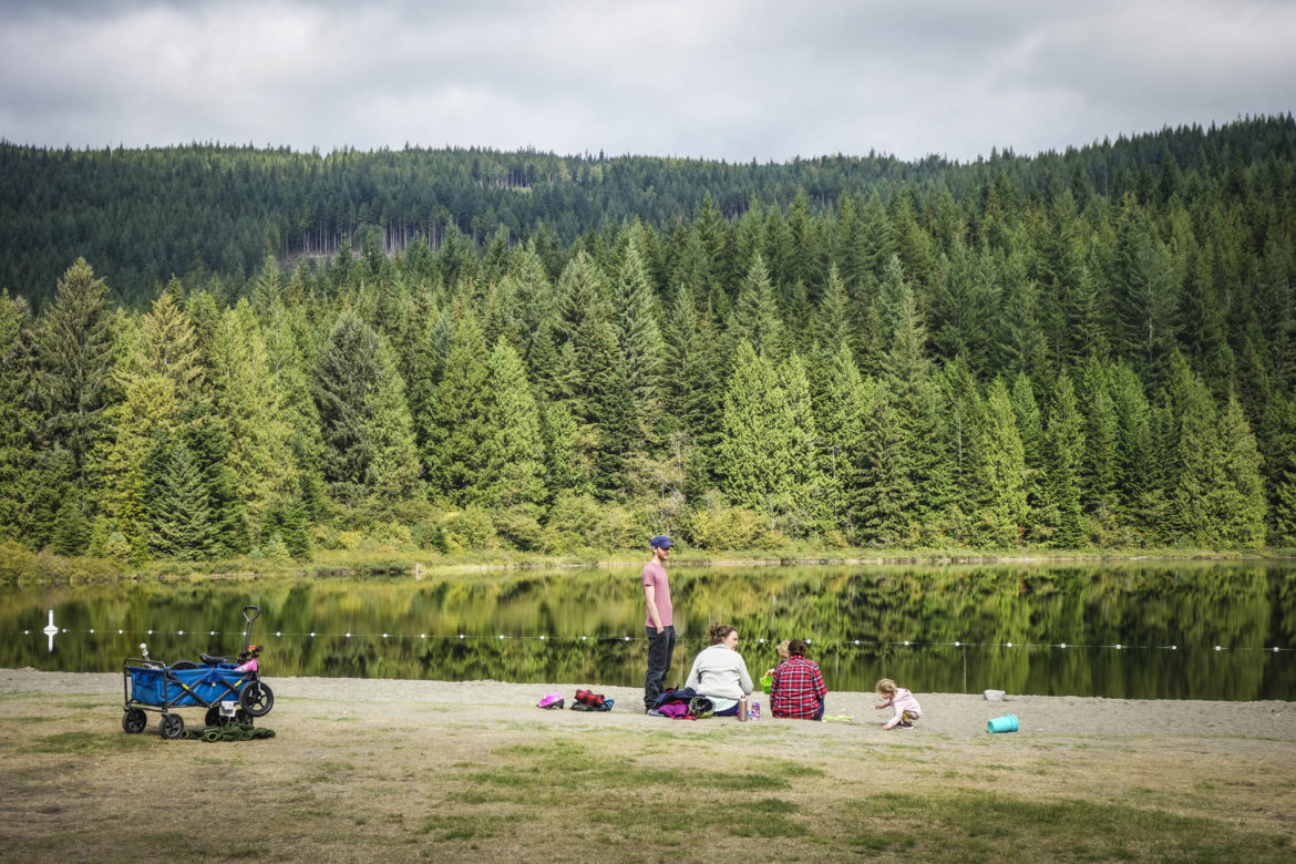 Everybody on the beach assessing the lake on the first morning – it was glass smooth all the way down the lake.