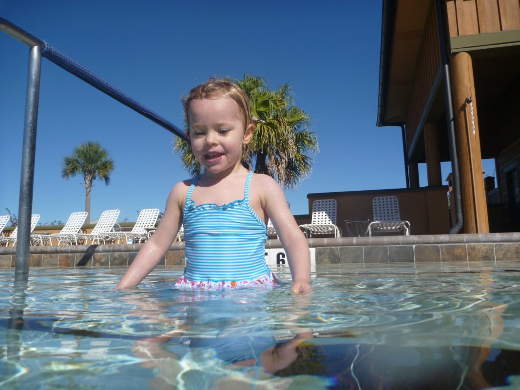 Addison taking a dip in the pool.